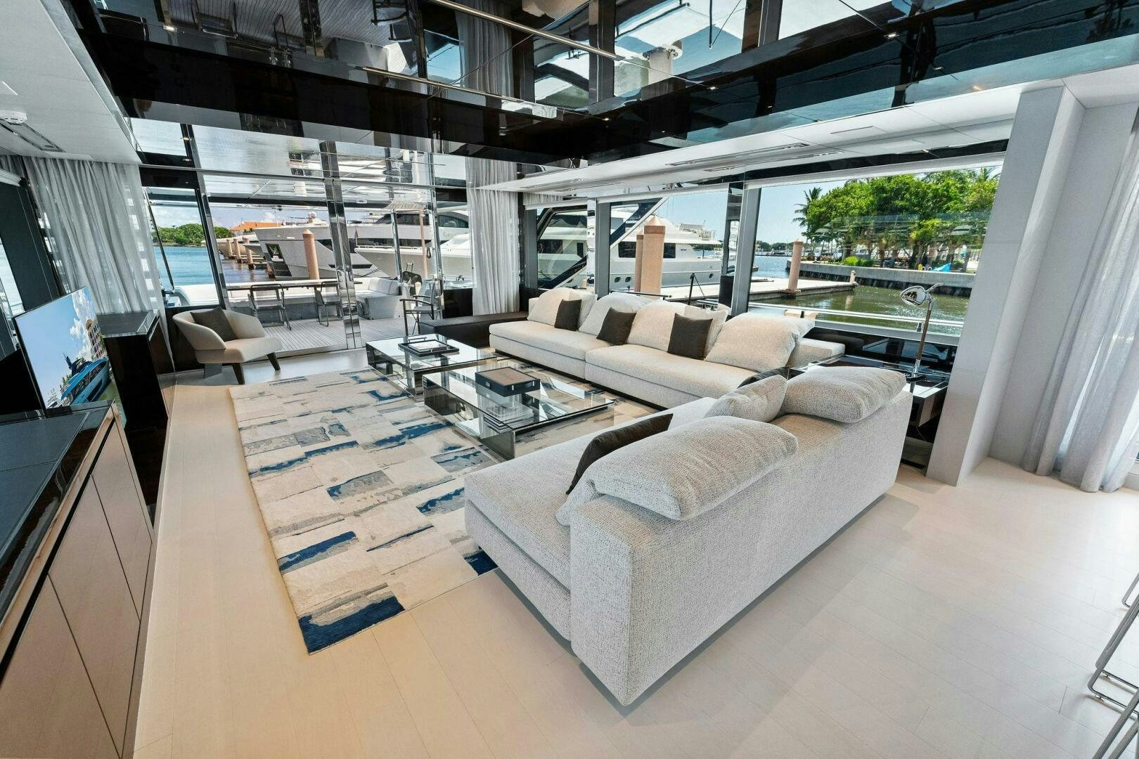 a living room with a couch and a table aboard 110' RIVA DOLCEVITA 2024 Yacht for Sale