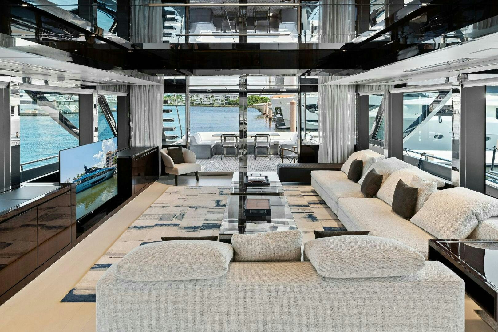 a living room with a large glass window aboard 110' RIVA DOLCEVITA 2024 Yacht for Sale