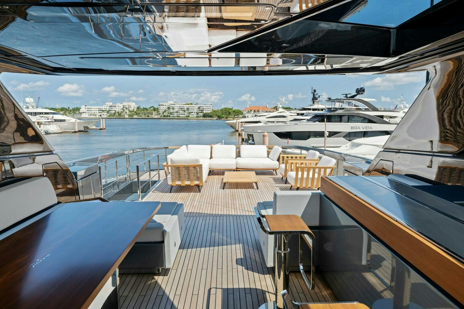 a deck with a view of a city and water aboard 110' RIVA DOLCEVITA 2024 Yacht for Sale
