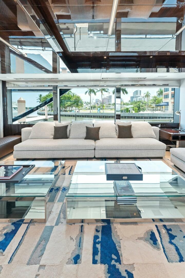 a living room with a large window aboard 110' RIVA DOLCEVITA 2024 Yacht for Sale
