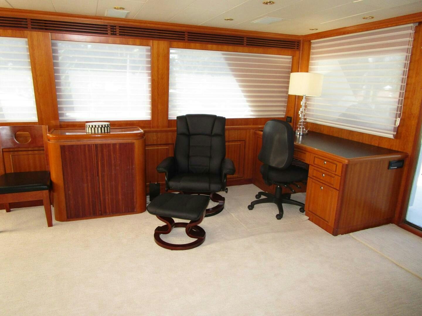 a room with a desk and chairs aboard LADY D Yacht for Sale