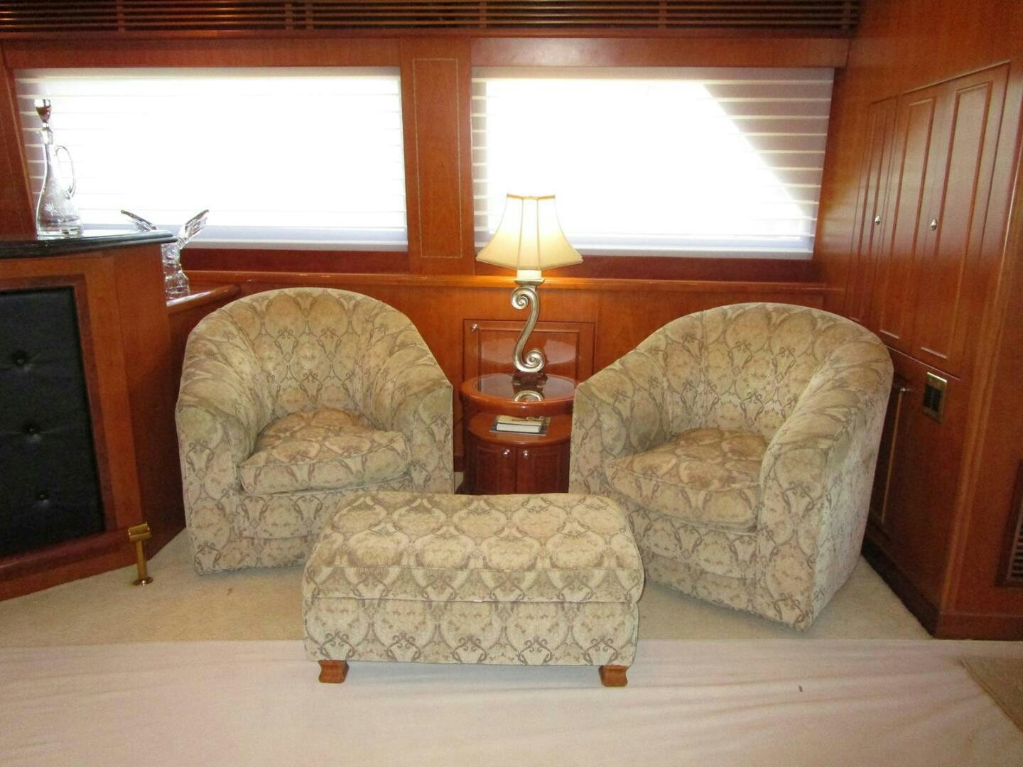 a living room with a couch and a lamp aboard LADY D Yacht for Sale
