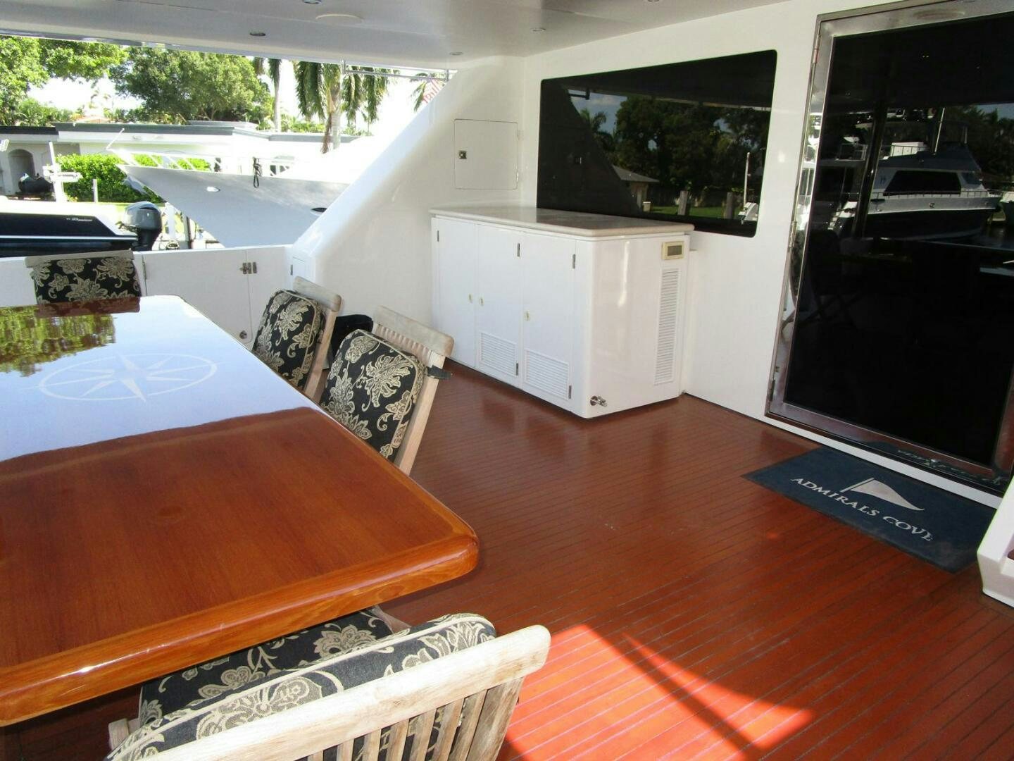 a table and chairs in a room aboard LADY D Yacht for Sale