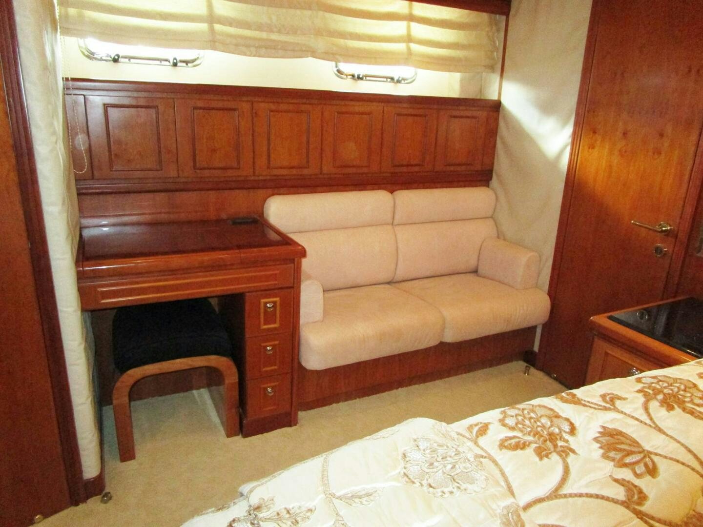a couch and a piano in a room aboard LADY D Yacht for Sale
