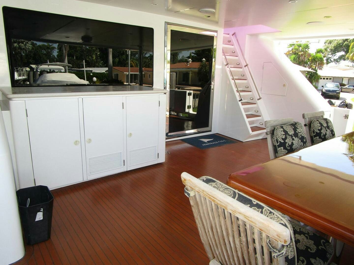 a kitchen with a table and chairs aboard LADY D Yacht for Sale