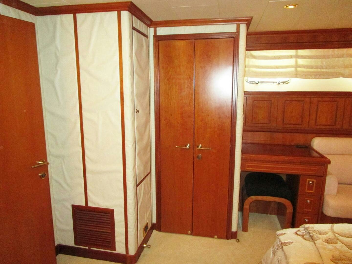 a room with wooden cabinets aboard LADY D Yacht for Sale