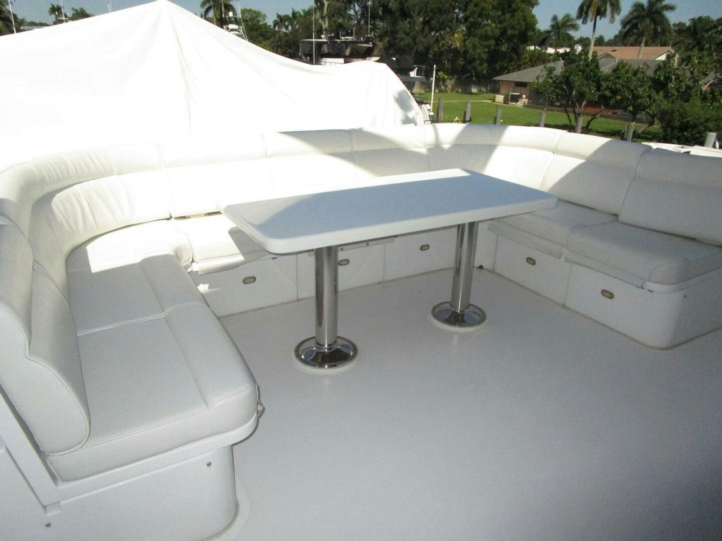 a white table with a white chair aboard LADY D Yacht for Sale