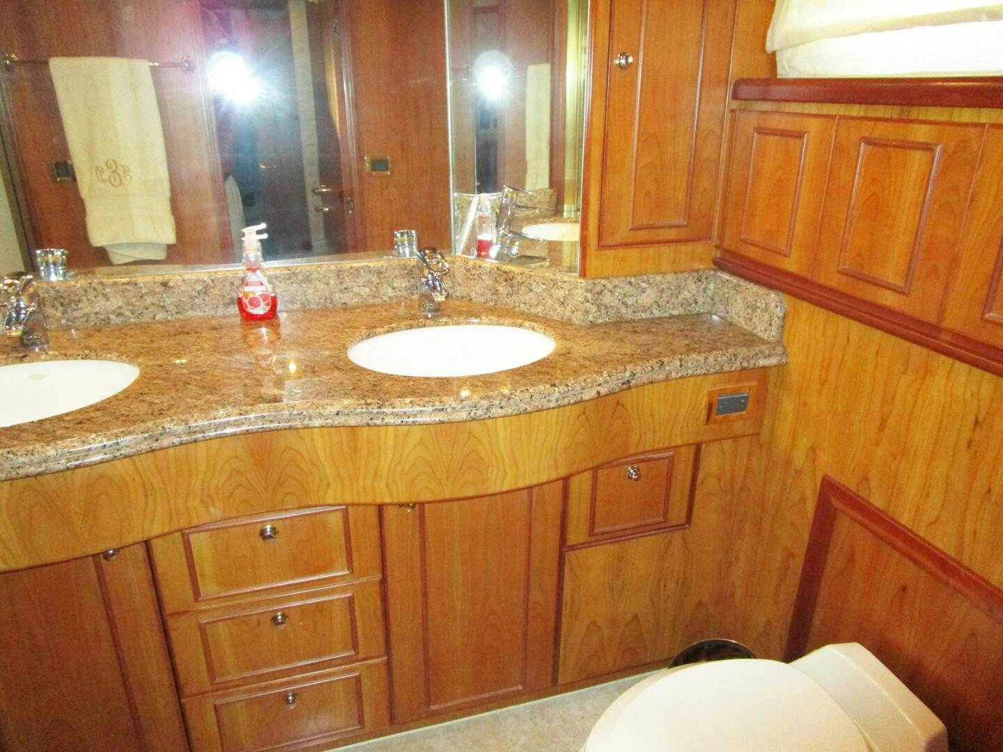 a bathroom with a countertop sink and a mirror aboard LADY D Yacht for Sale