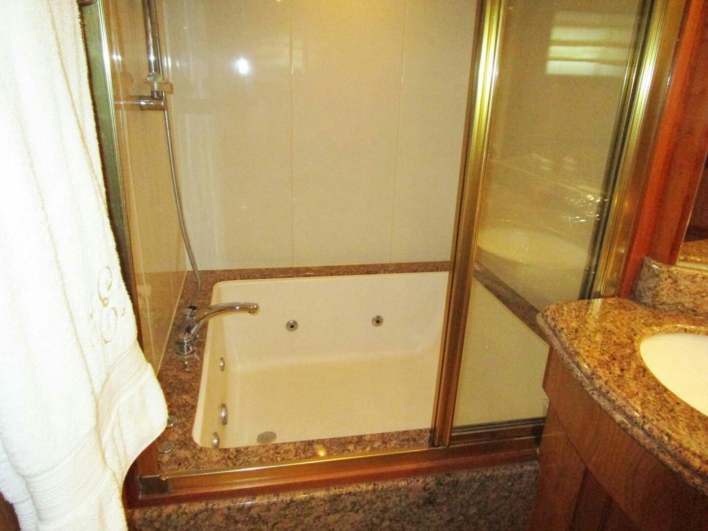 a bathroom with a bathtub and sink aboard LADY D Yacht for Sale