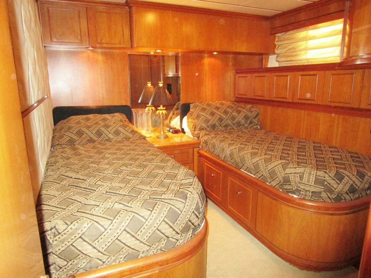 a room with wooden furniture aboard LADY D Yacht for Sale