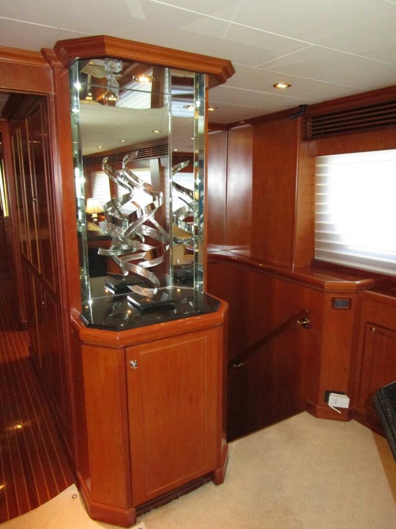a large cabinet in a room aboard LADY D Yacht for Sale
