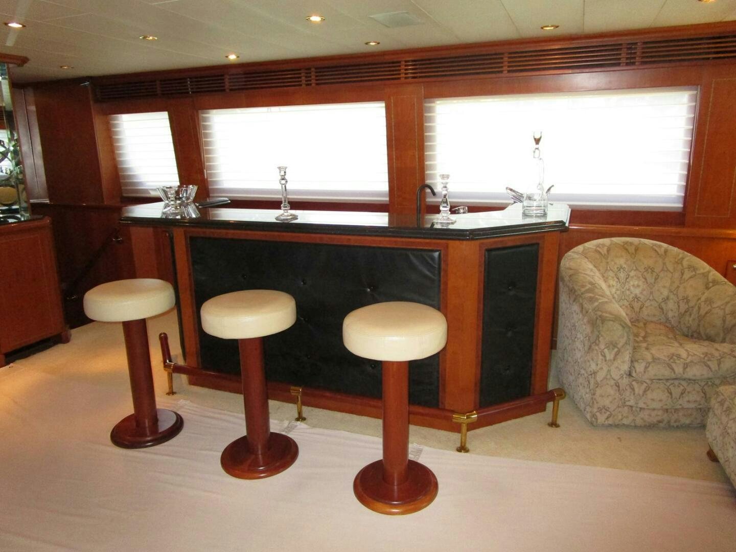 a kitchen with stools and stools aboard LADY D Yacht for Sale