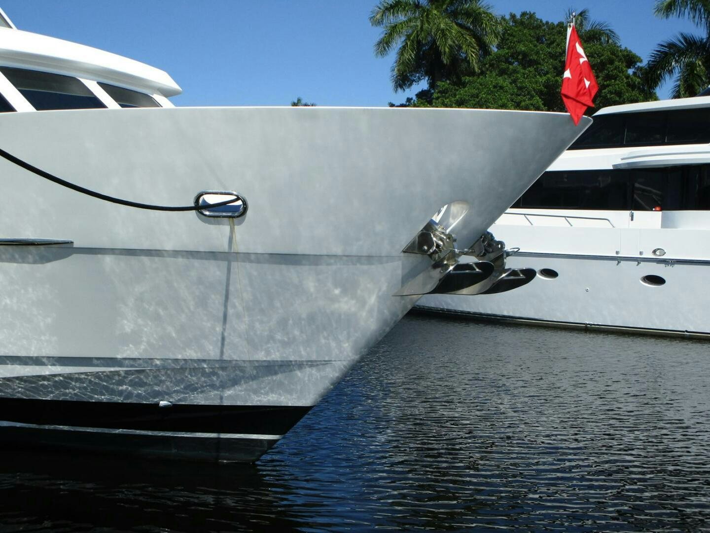 a boat with a flag on the front aboard LADY D Yacht for Sale