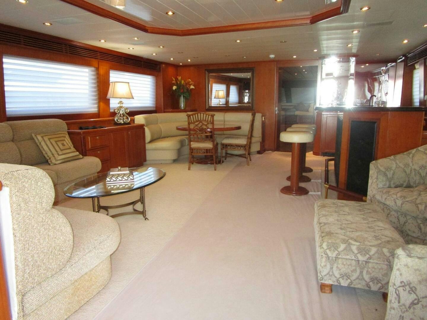 a living room with a couch and a coffee table aboard LADY D Yacht for Sale