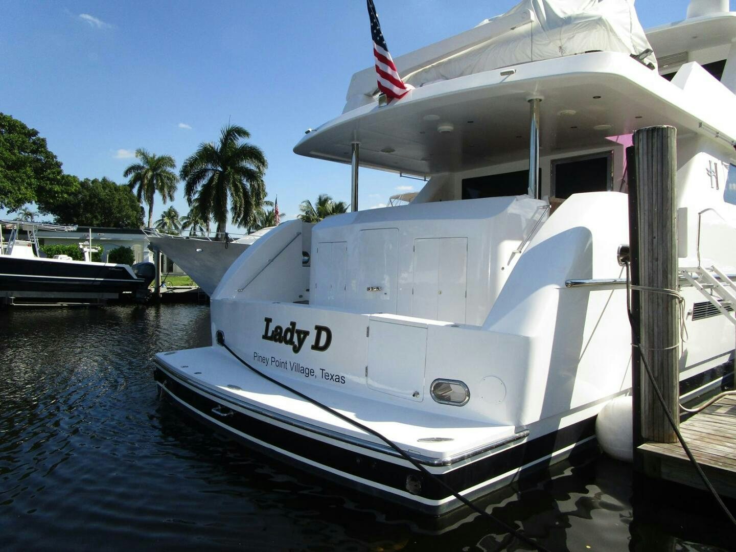 a white boat on a body of water aboard LADY D Yacht for Sale
