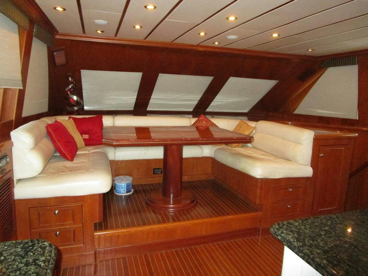 a room with a table and couch aboard LADY D Yacht for Sale