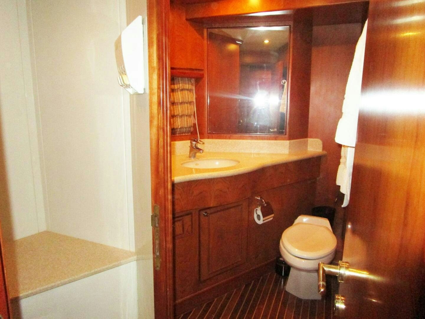 a bathroom with a toilet and a sink aboard LADY D Yacht for Sale