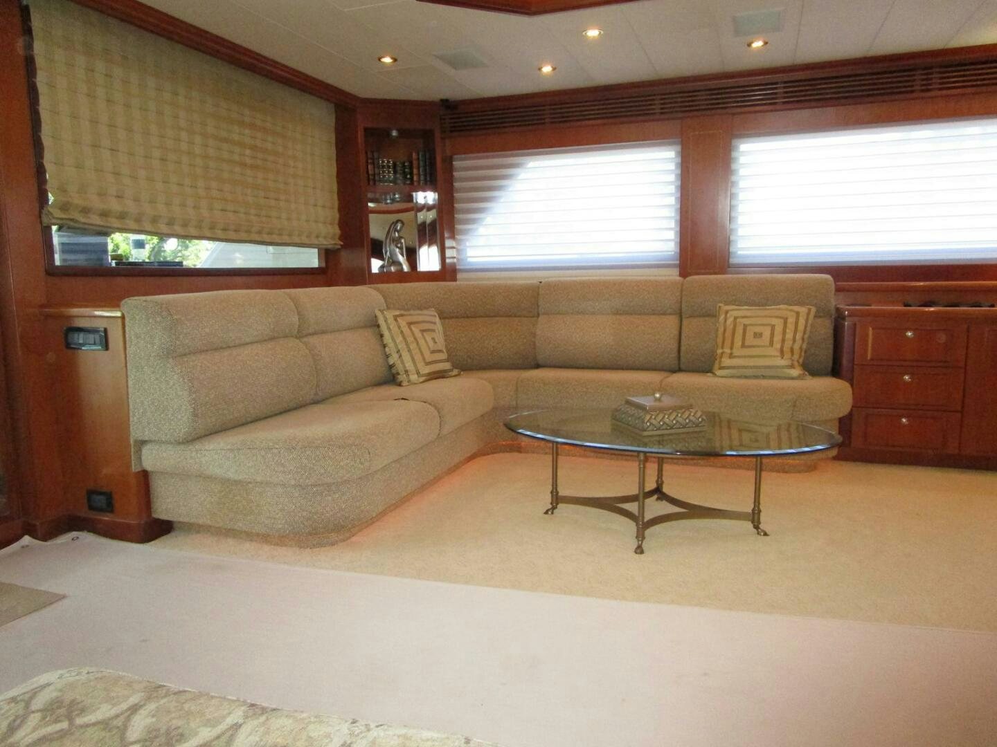 a living room with a couch and coffee table aboard LADY D Yacht for Sale