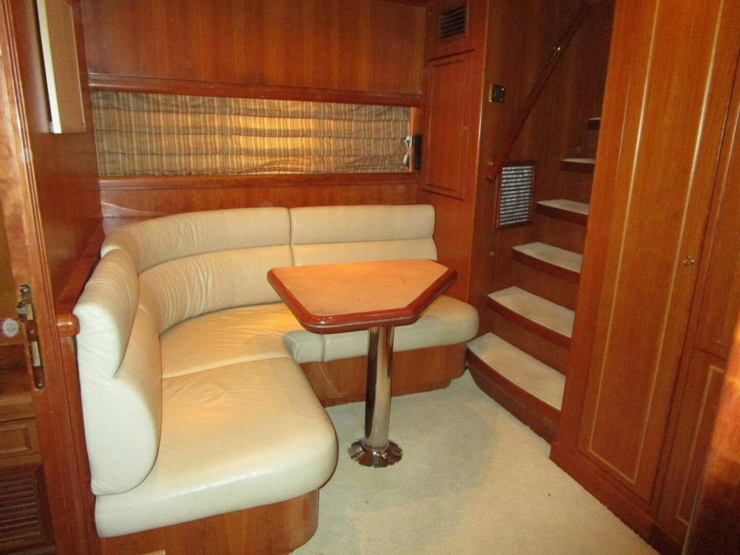 a couch and a table in a room aboard LADY D Yacht for Sale