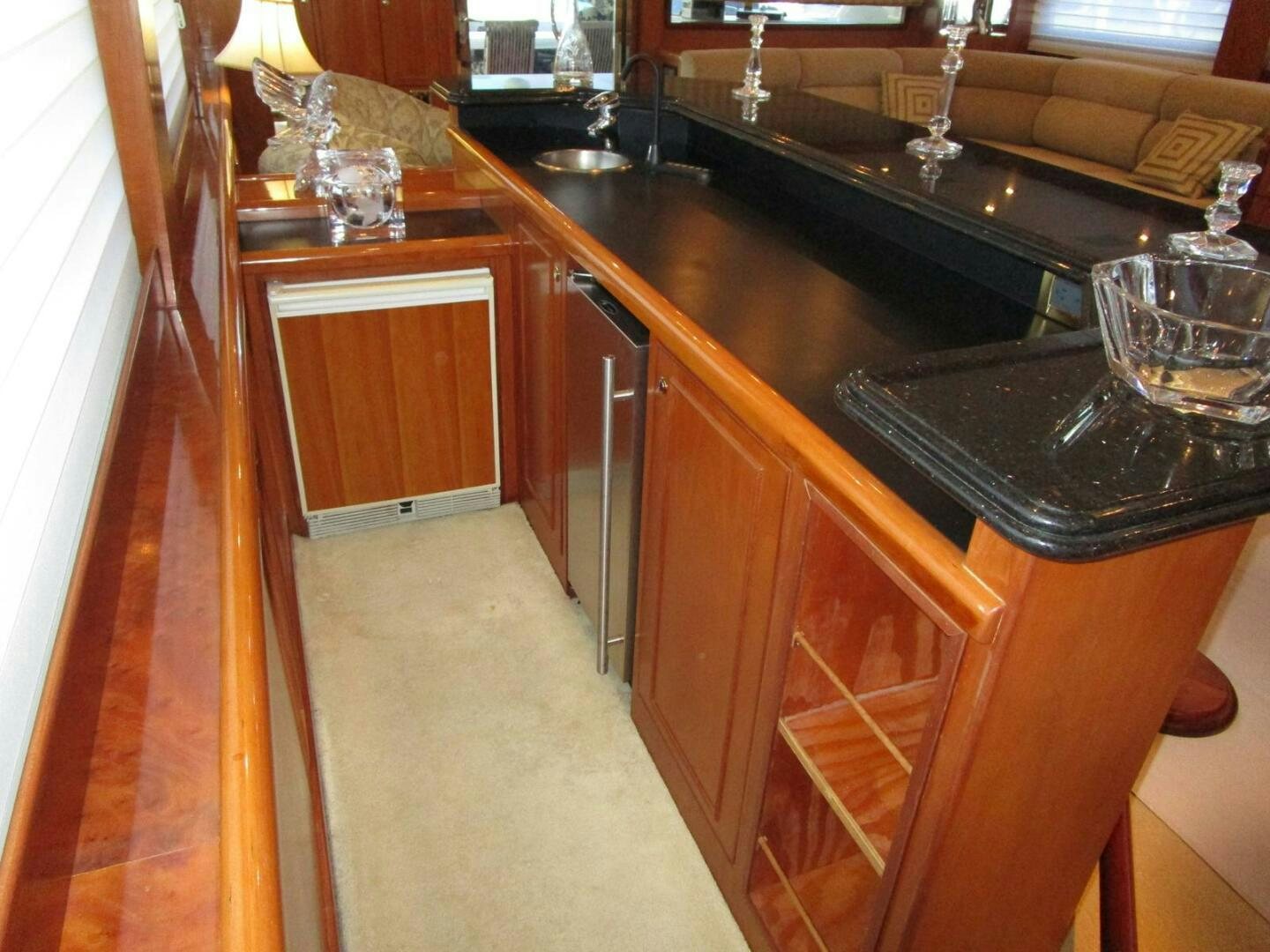 a kitchen with wooden cabinets aboard LADY D Yacht for Sale