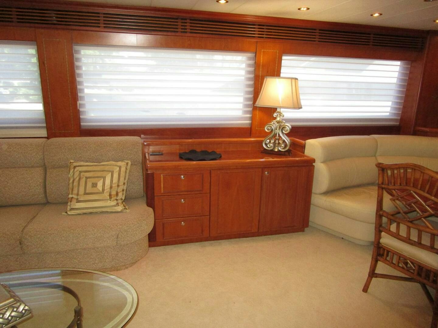 a living room with a couch and a lamp aboard LADY D Yacht for Sale