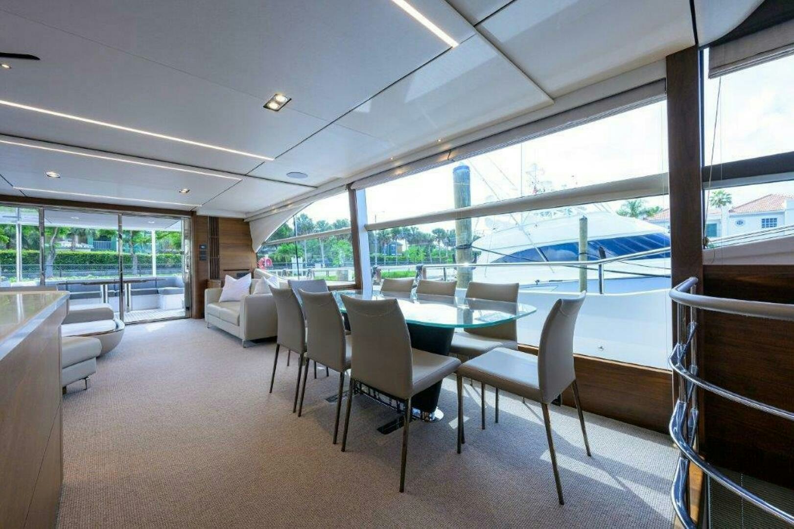 a room with a table chairs and a large window aboard TARHEEL Yacht for Sale