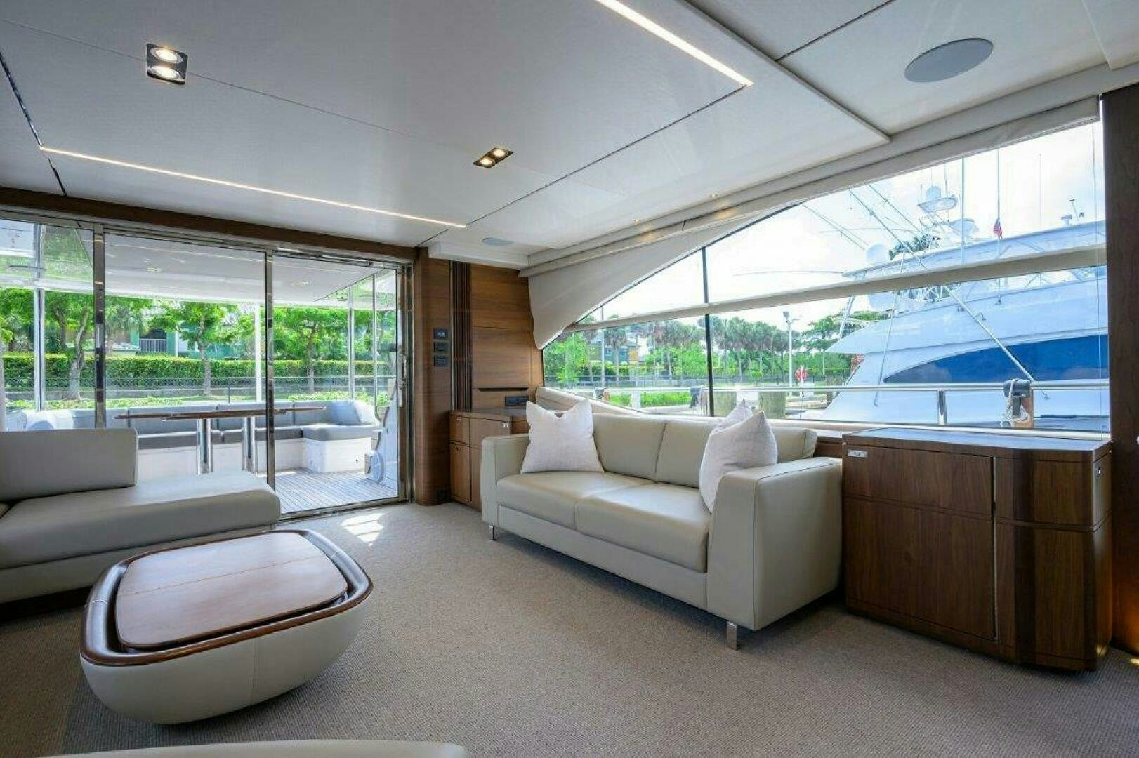 a living room with a large window aboard TARHEEL Yacht for Sale