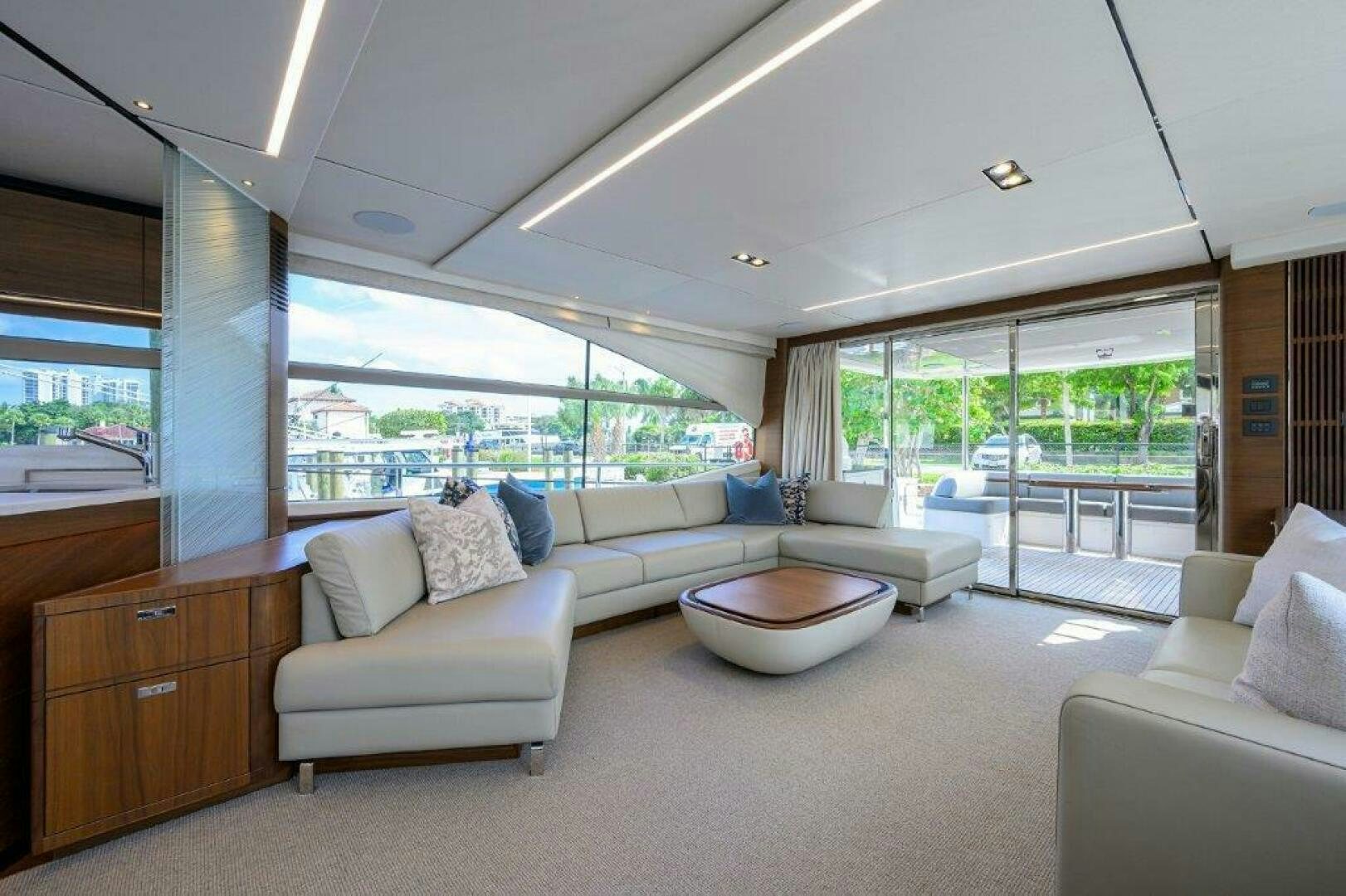 a living room with a large window aboard TARHEEL Yacht for Sale