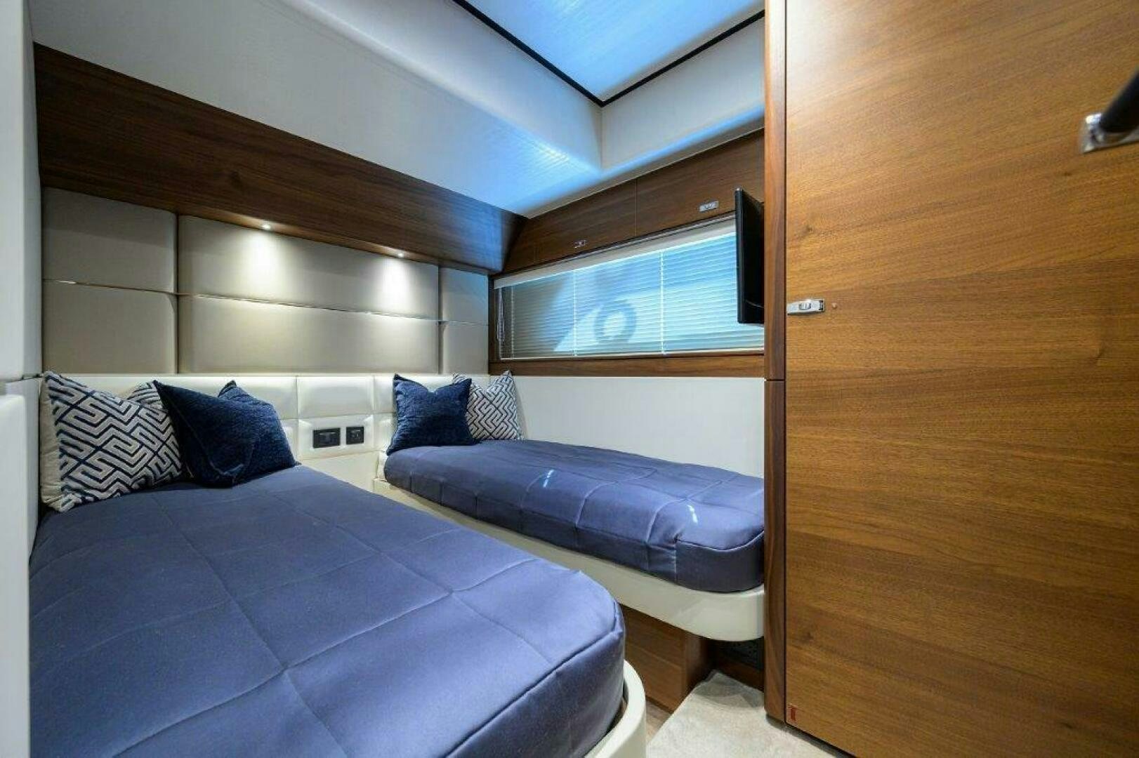 a room with a bed and a couch aboard TARHEEL Yacht for Sale
