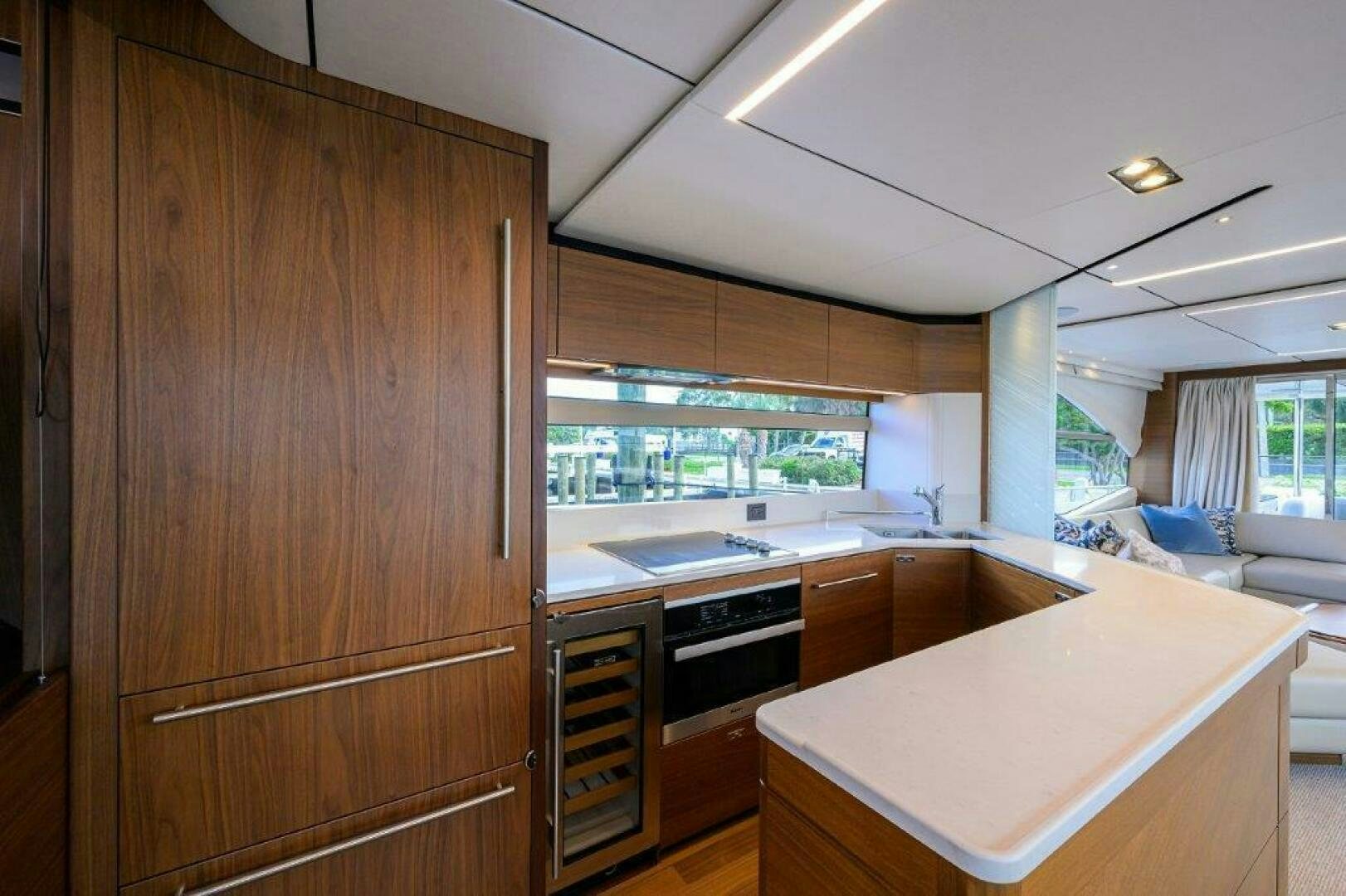 a kitchen with wooden cabinets aboard TARHEEL Yacht for Sale