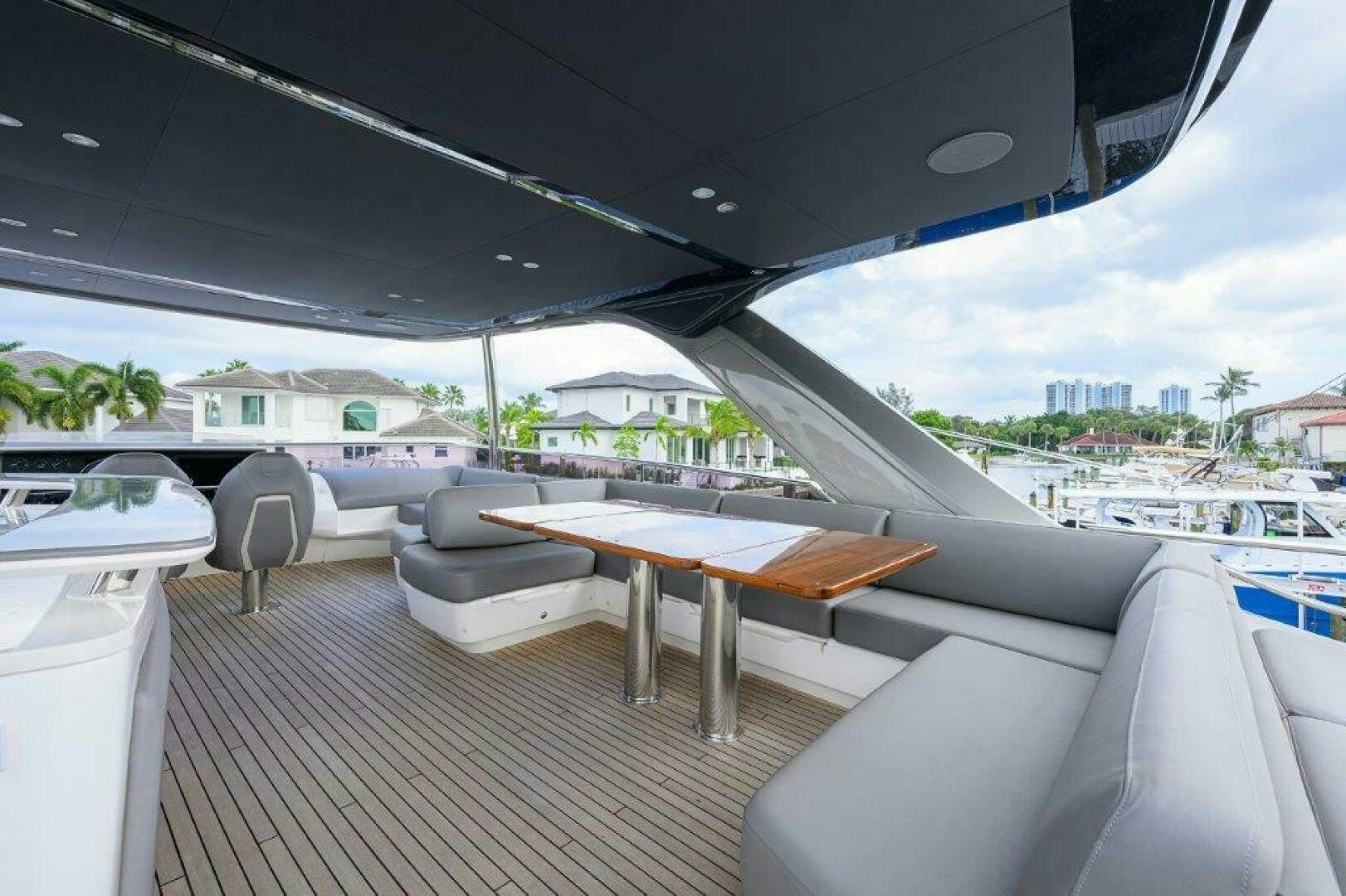 a table and chairs on a deck aboard TARHEEL Yacht for Sale