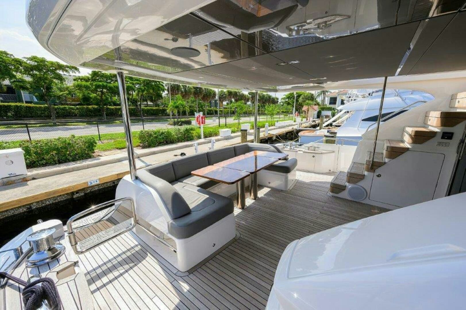 a room with a table and chairs aboard TARHEEL Yacht for Sale