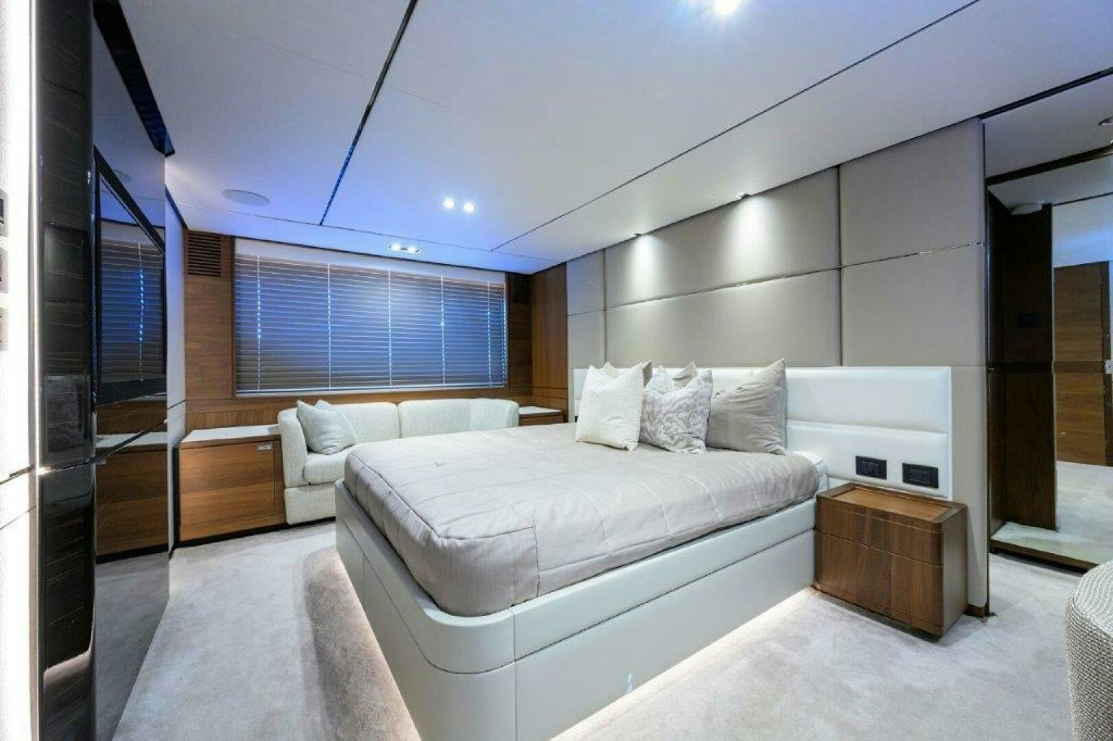 a room with a bed and a window aboard TARHEEL Yacht for Sale