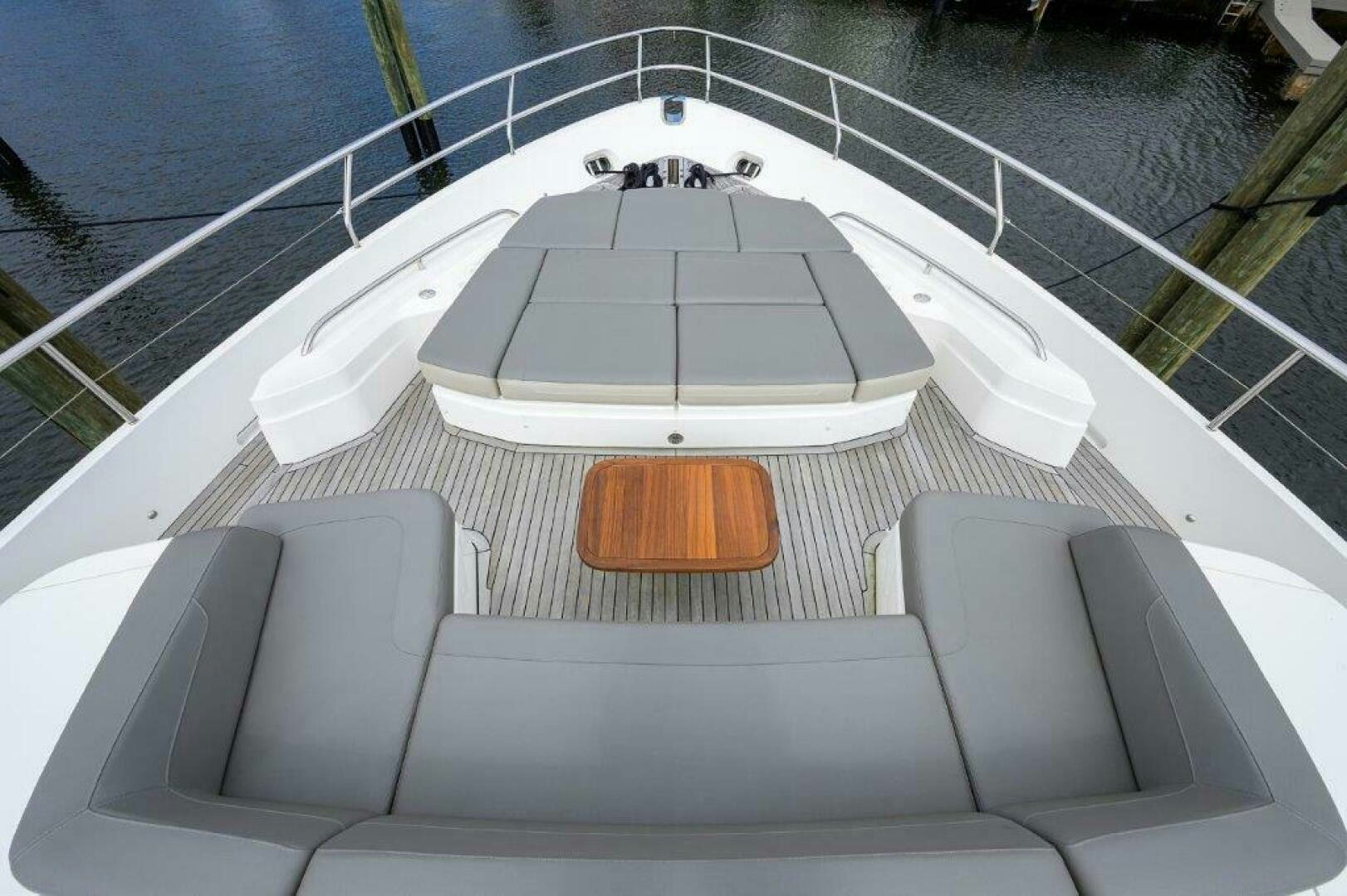 a white boat on a body of water aboard TARHEEL Yacht for Sale