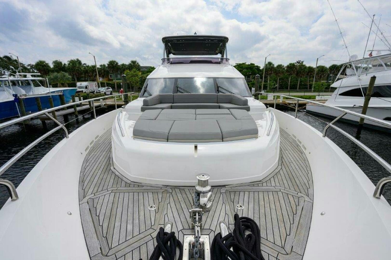 a white boat on a dock aboard TARHEEL Yacht for Sale