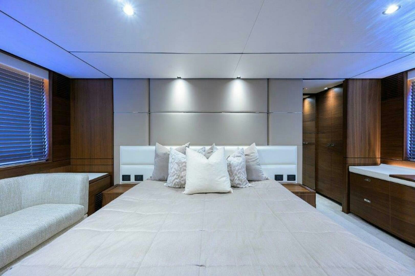a bed with white pillows aboard TARHEEL Yacht for Sale