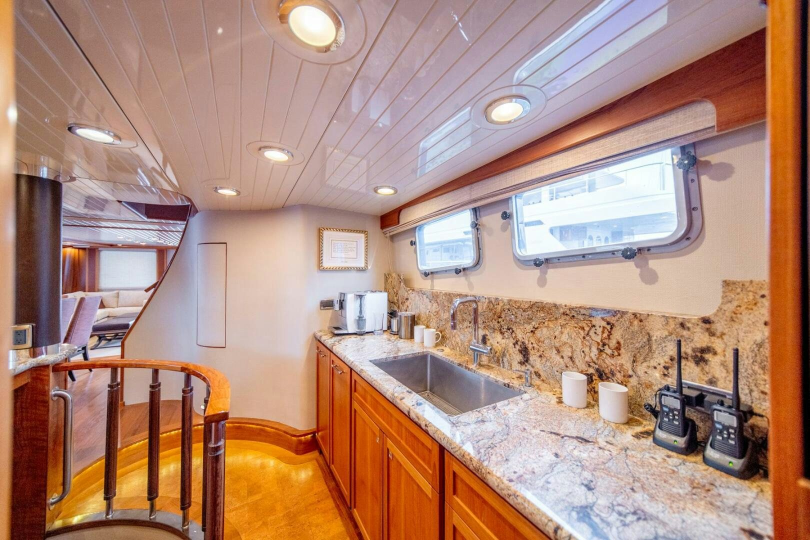 a kitchen with a countertop sink and a microwave oven aboard SEA LION Yacht for Sale