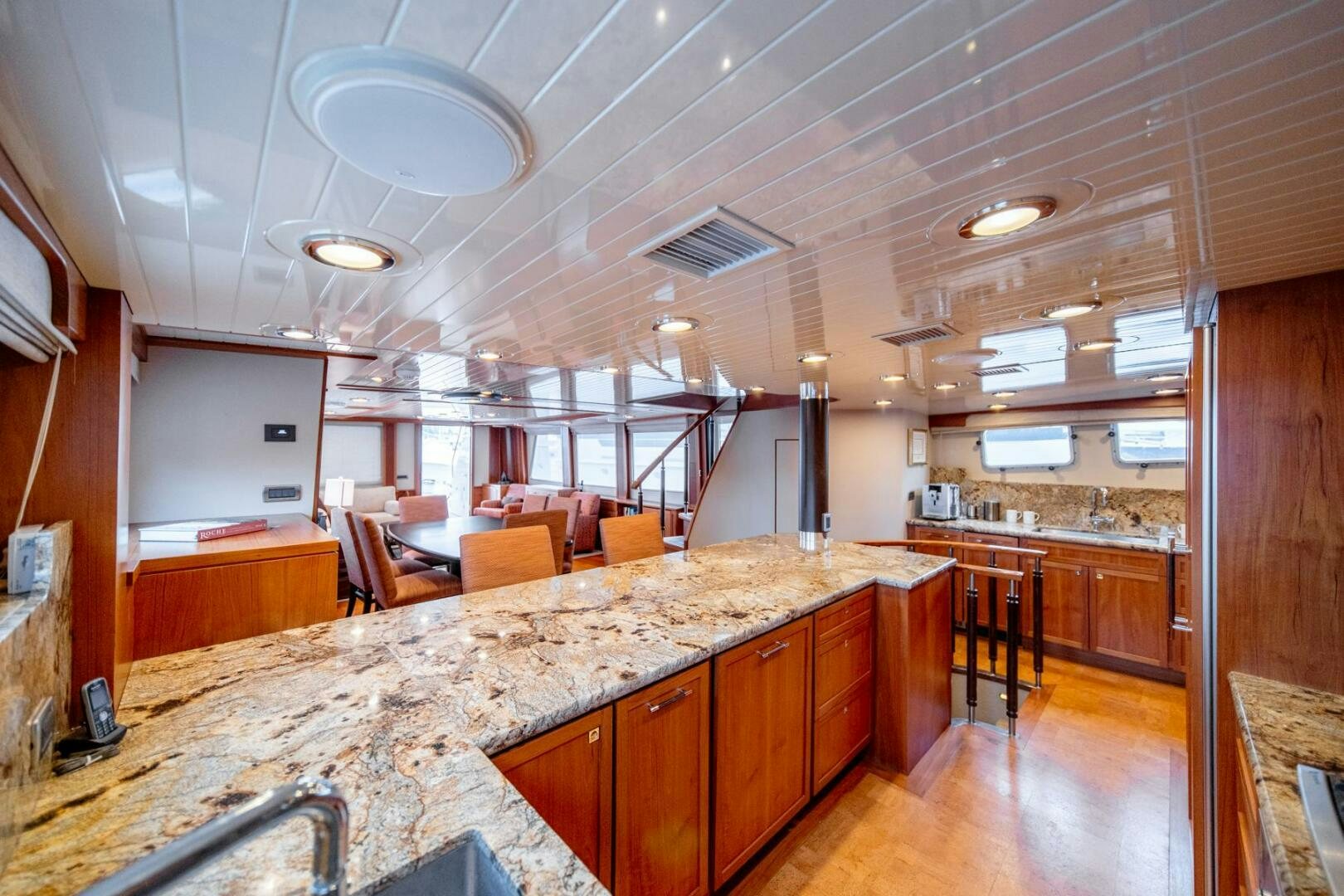 a large kitchen with wooden cabinets aboard SEA LION Yacht for Sale
