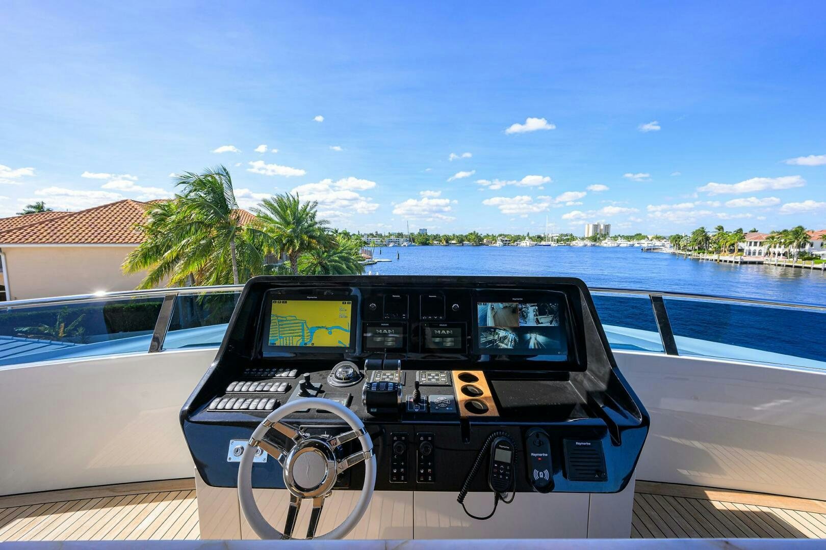 a black car on a deck aboard AMORE Yacht for Sale