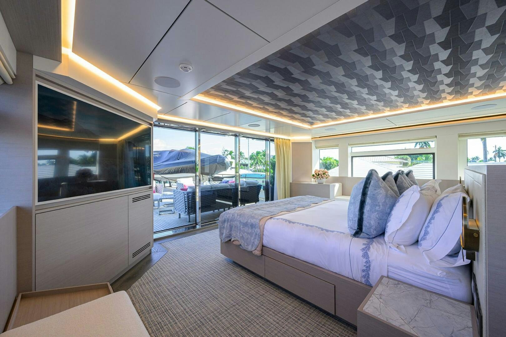 a bedroom with a large bed aboard AMORE Yacht for Sale