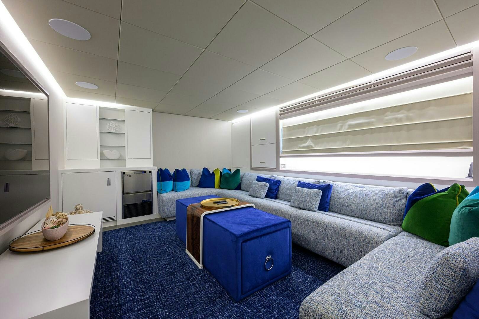 a living room with a couch and a table aboard AMORE Yacht for Sale