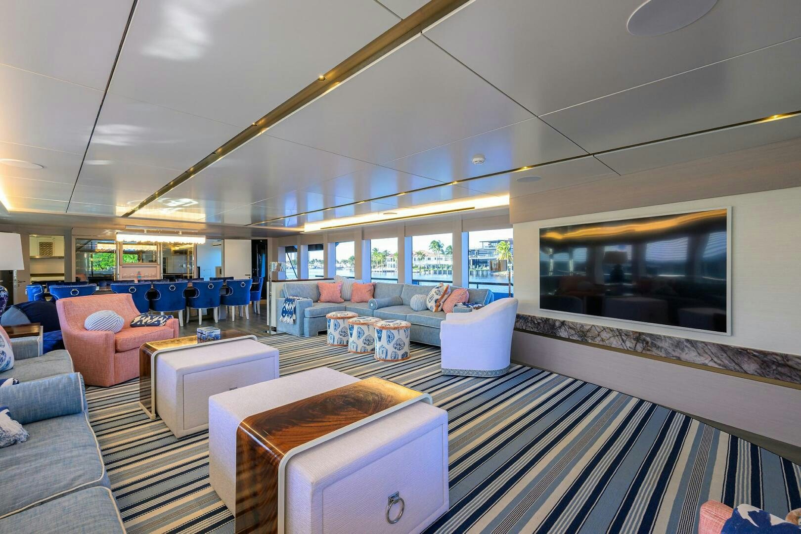 a room with a tv and a couch aboard AMORE Yacht for Sale