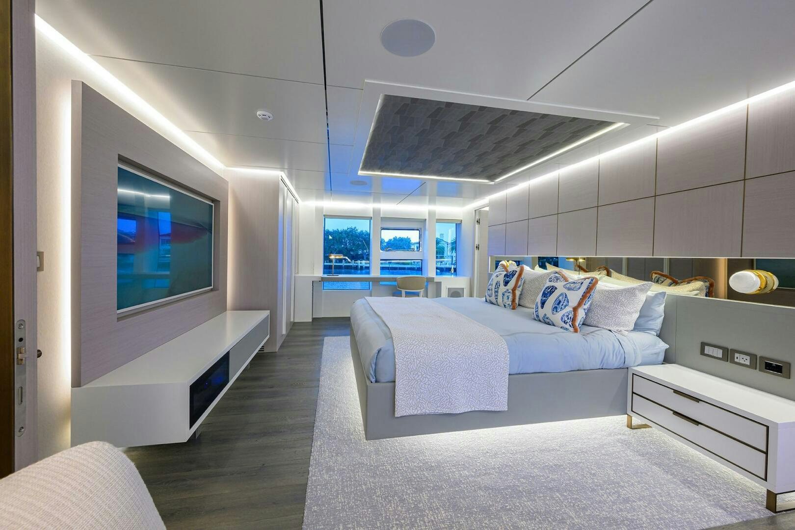 a room with a bed and a tv aboard AMORE Yacht for Sale
