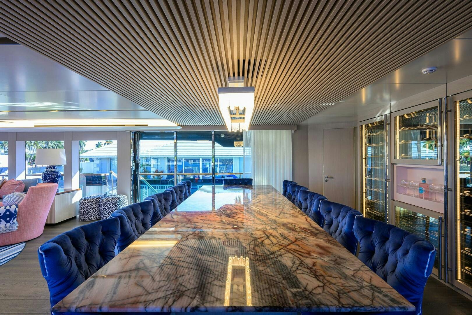 a large living room with a large window aboard AMORE Yacht for Sale