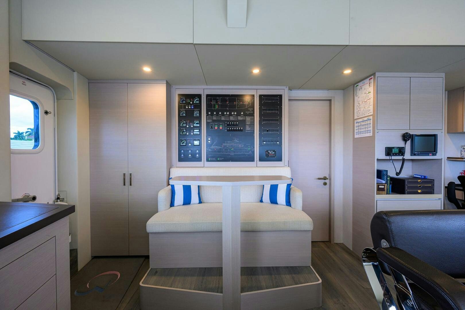 a room with a bed and a desk aboard AMORE Yacht for Sale