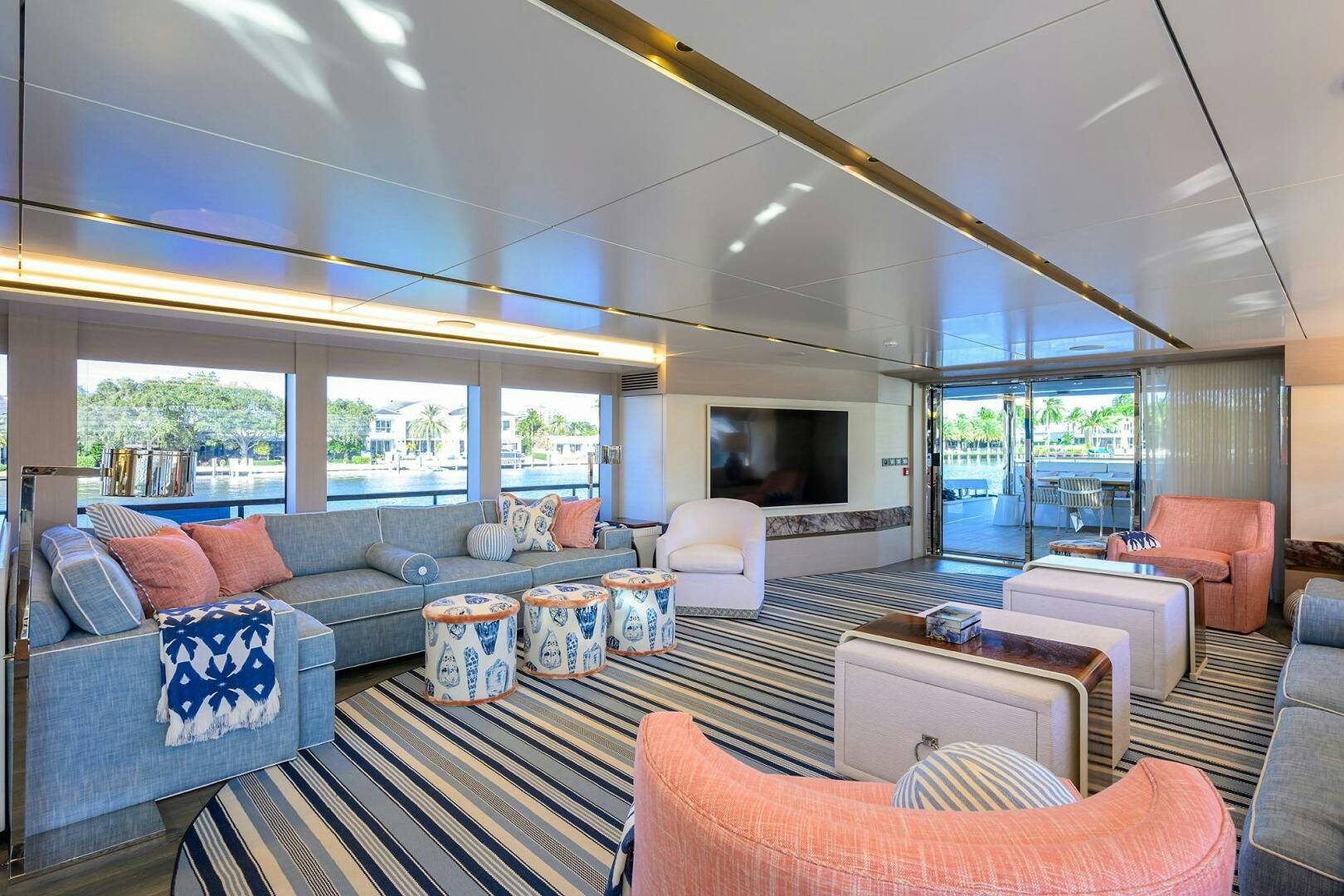 a living room with a large window aboard AMORE Yacht for Sale