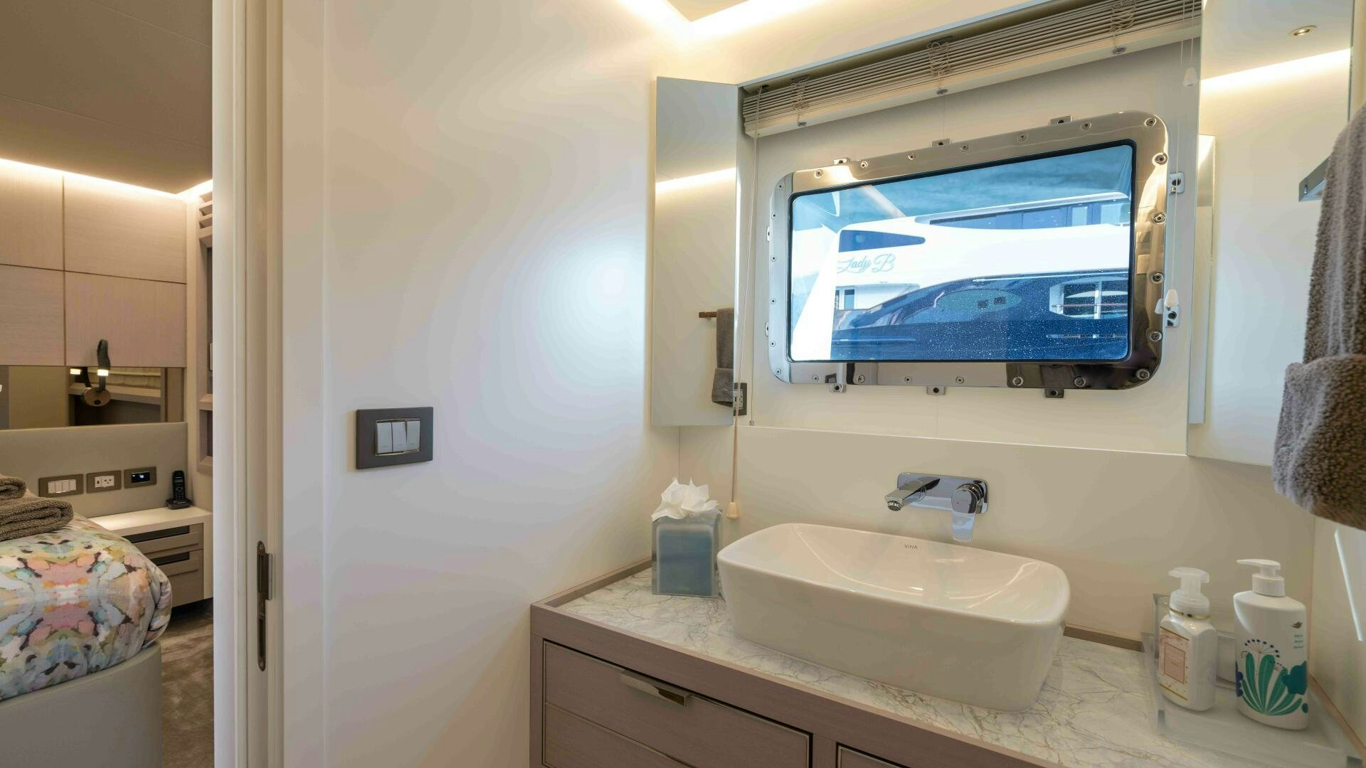 a bathroom with a tv aboard AMORE Yacht for Sale