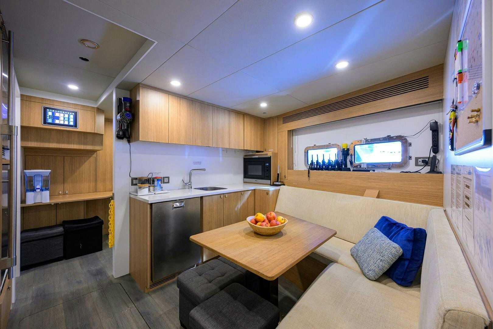 a kitchen with a couch and a tv aboard AMORE Yacht for Sale