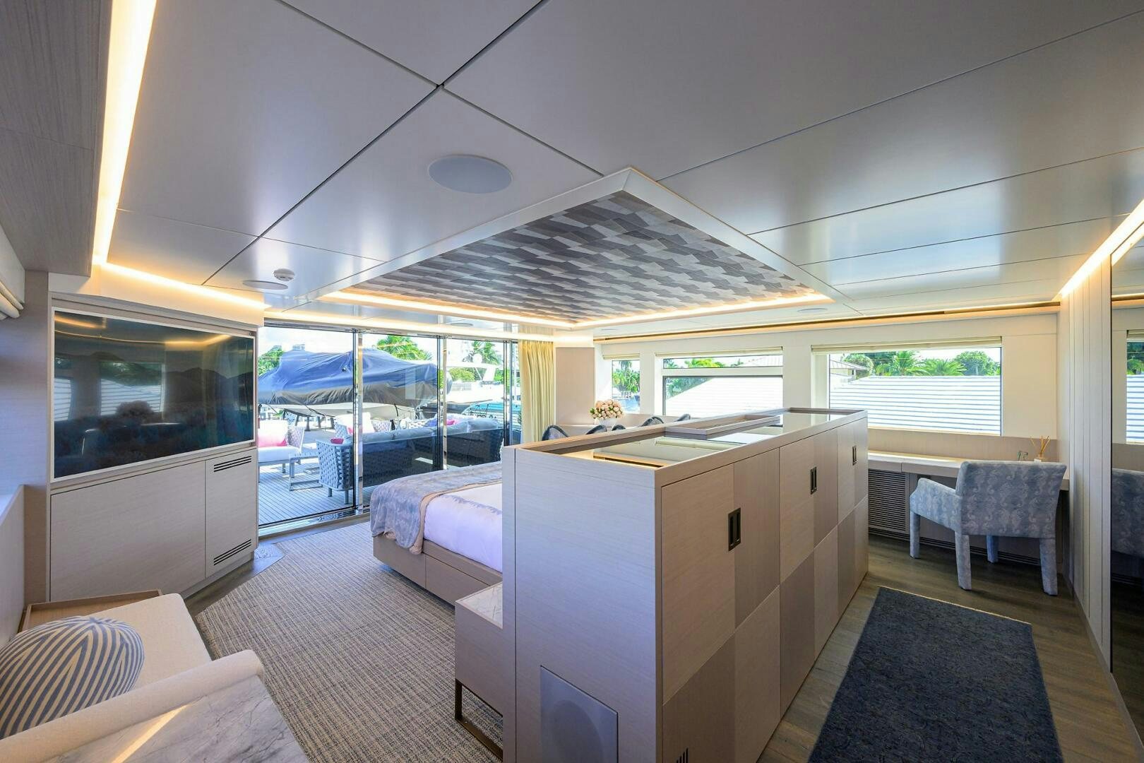 a room with a bed and a table aboard AMORE Yacht for Sale