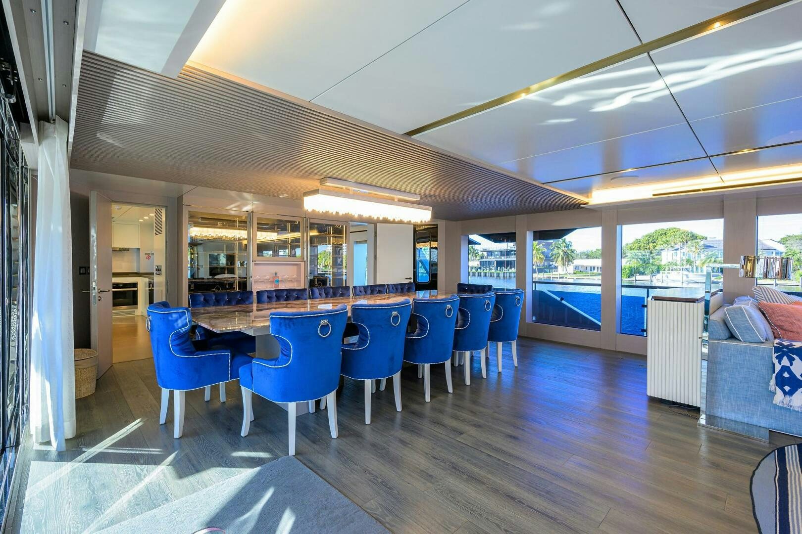 a room with a table and chairs aboard AMORE Yacht for Sale